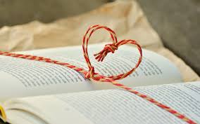 red strands of string in a heart shape